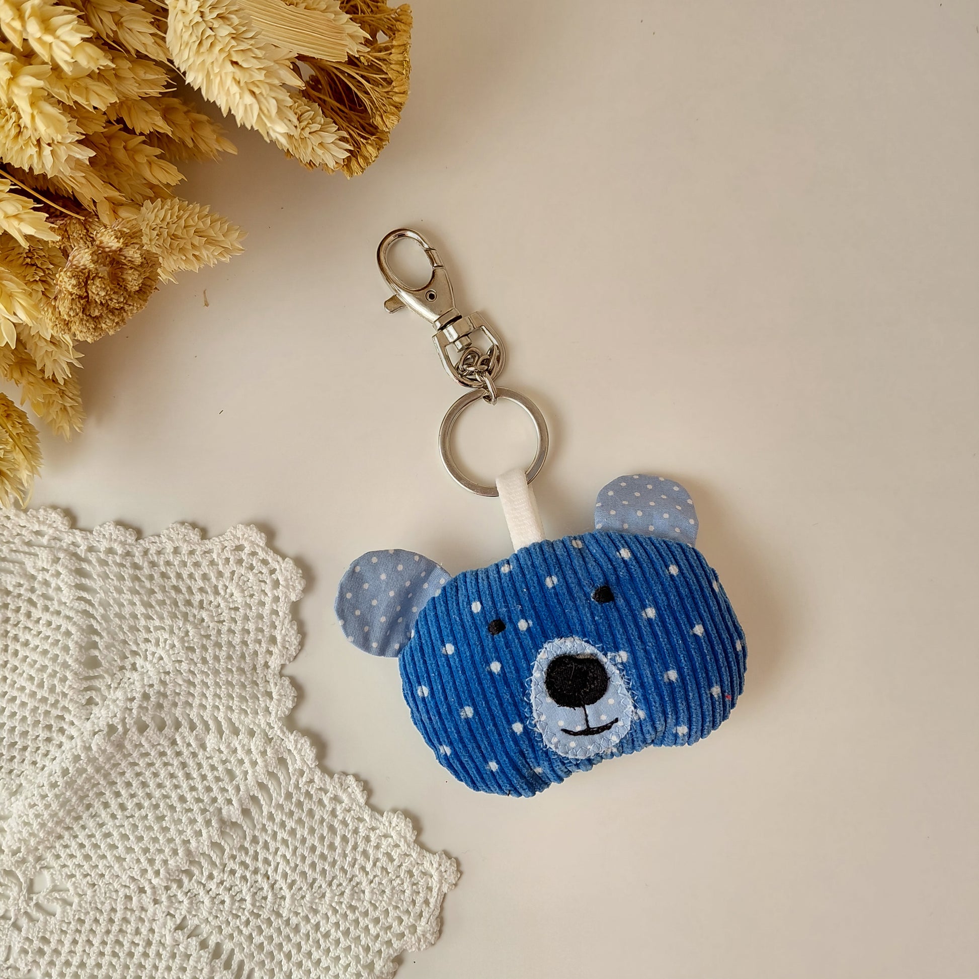 Blue teddy bear keychain with white polka dots 
