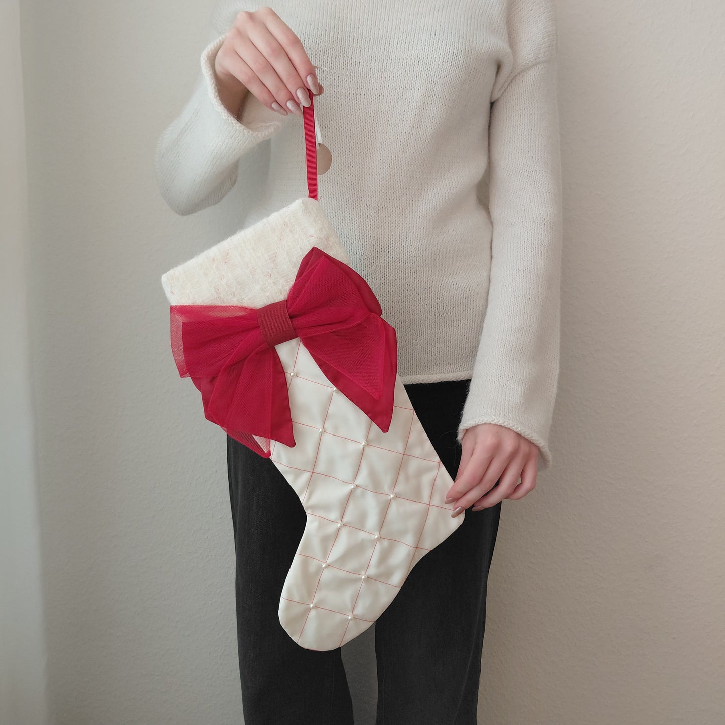 White Christmas stocking with a red bow r.