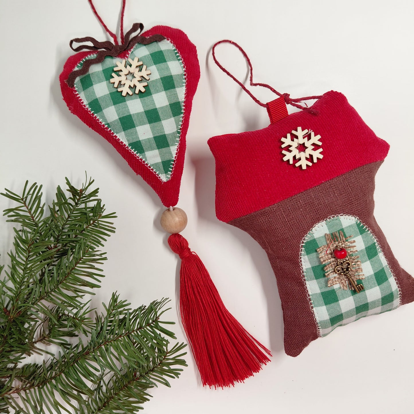 Two festive Christmas ornaments with red and green checkered patterns 