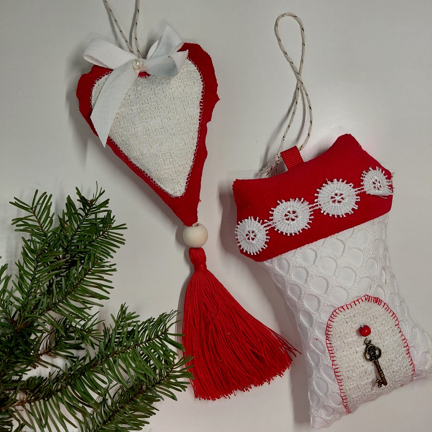 Red and white Christmas ornaments with a tassel and decorative elements 