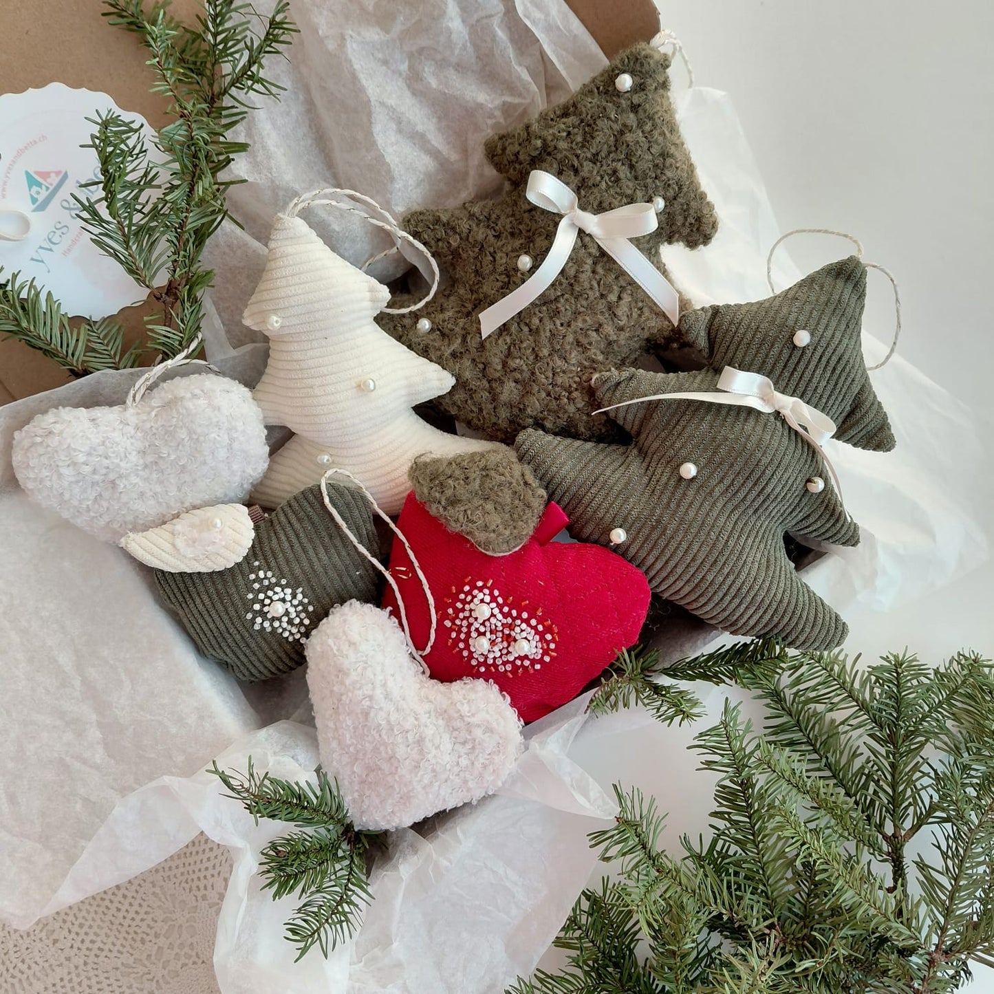 Collection of Christmas-themed decorative items including trees and hearts 