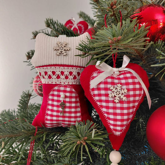 Red and white checkered heart-shaped ornaments on a Christmas tree.