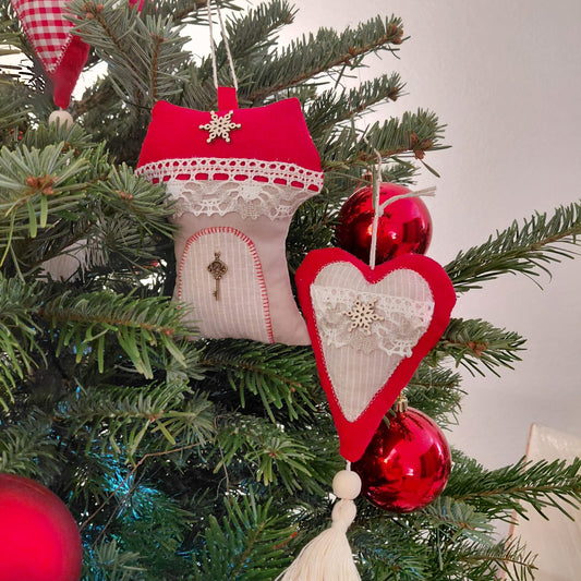 Decorative Christmas ornaments on a tree with red and white heart-shaped ornament.